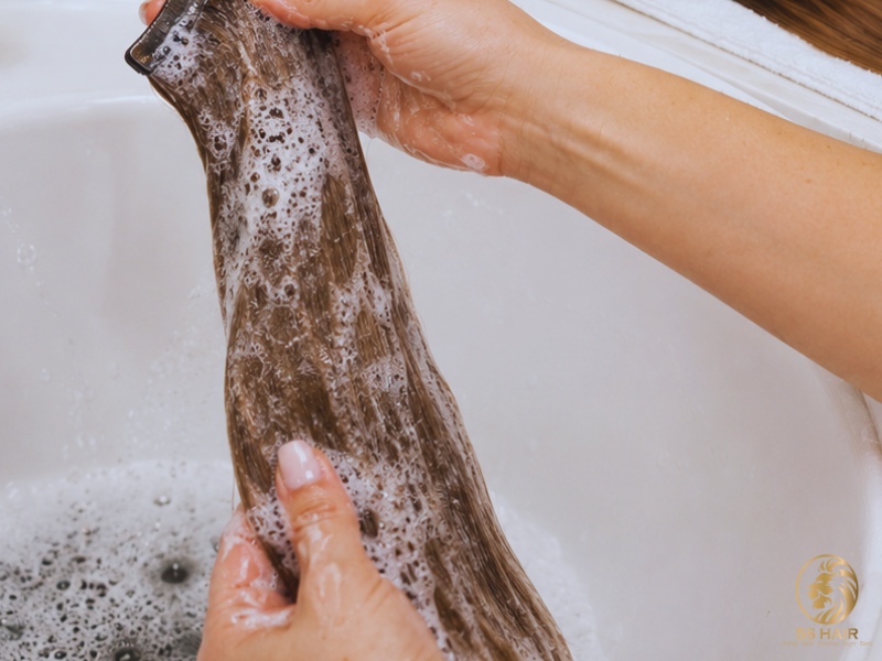 Wash the wefts with a clarifying shampoo to remove residue and buildup, then dry them completely.